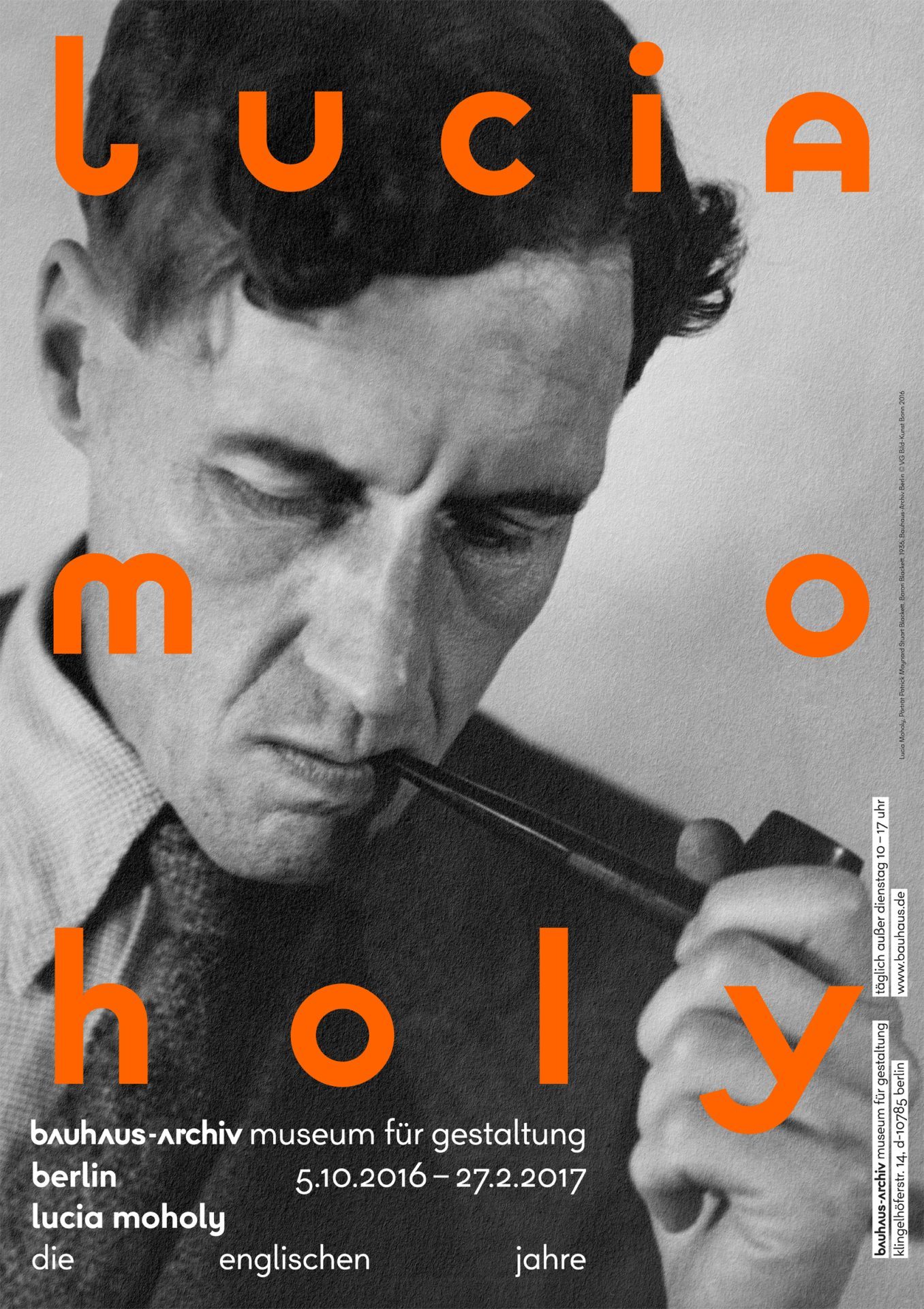 Portrait of a man with a pipe, surrounded by orange text for the Lucia Moholy exhibition in Berlin.